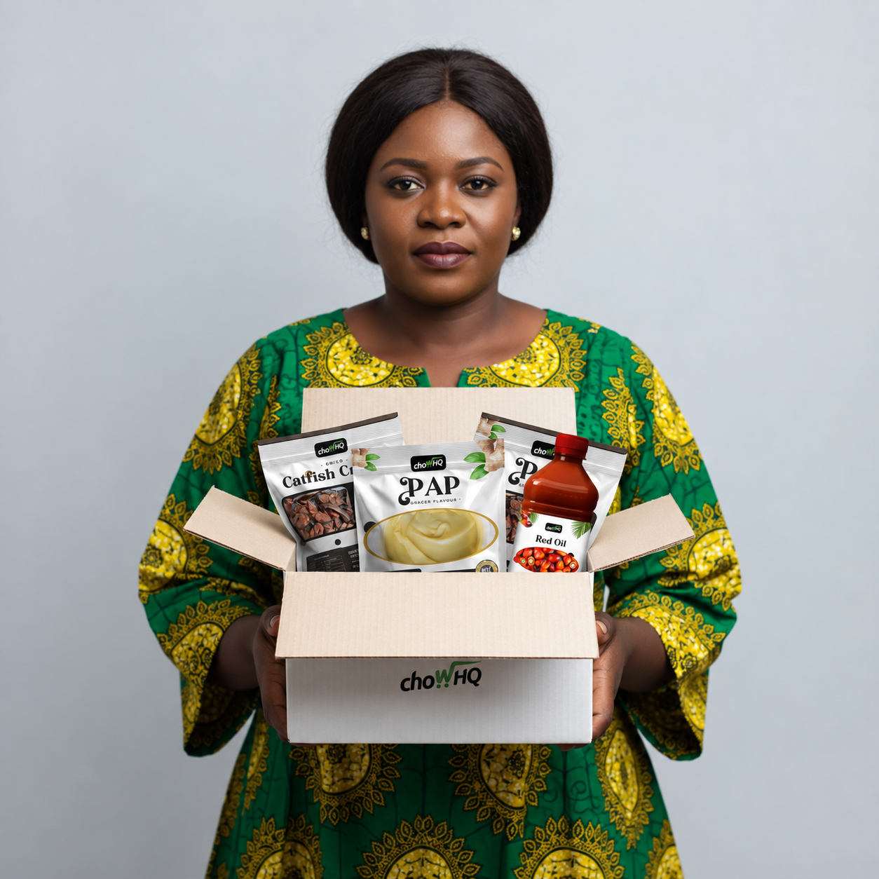 ChowHQ founder holding a box of African grocery products